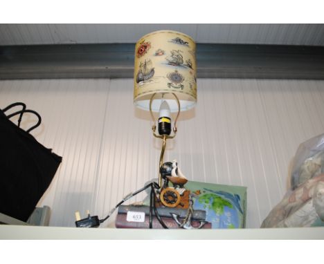 A decorative table lamp and shade 