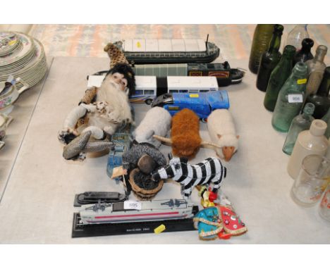 A model train; a ceramic money bank in the form of a train etc.