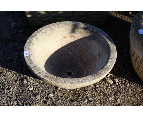 A concrete  planter of cone form