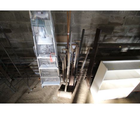 A quantity of wooden handled gardening tools to include digging forks, spades, rakes, wooden mallet etc