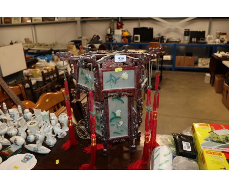 An Oriental style candle lantern having bird decorated panels 