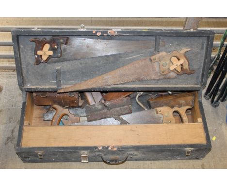 A wooden toolchest and contents of tools comprising hand saws; moulding planes etc.