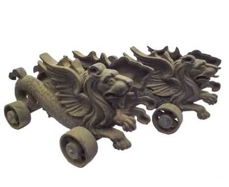 A pair of 19th Century mythical beast form cast iron cannon carriages, to take barrels of 15cm width, each carriage composed 