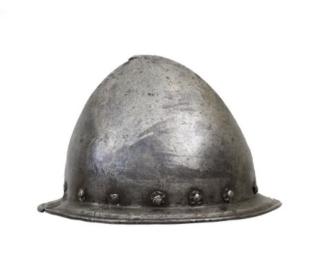 A 17th Century Italian Cabasset, characteristic almond-shaped skull with flattened stalk finial, shallow guttered brim with t