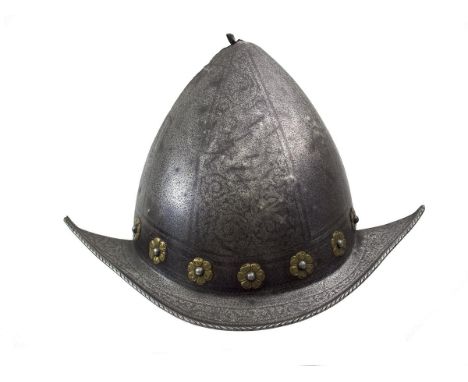 A 17th Century Italian etched Morion-Cabasset in the Pisan style, two-piece skull of characteristic almond form with  down sw