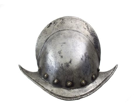 An early 17th Century Italian Comb Morion, two-piece skull of characteristic form with tall raised comb with single tramline 