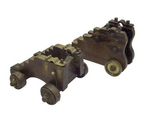 Two various brass mounted model cannon carriages, the first to take a barrel of 6.5cm in width, the second to take a barrel o
