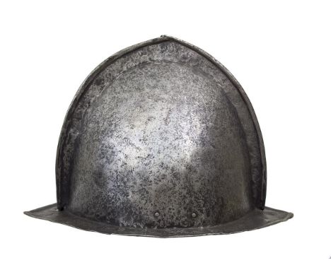 A crude 17th Century Morion, the two-piece skull with turned low comb, shallow brim with turned edge and struck with an indis