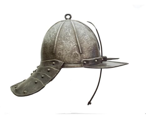 A mid-17th Century North European Lobster Tailed Pot, the ribbed two-piece skull with ring finial and pointed peak, this with