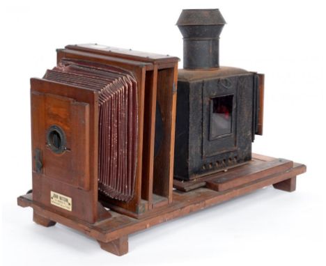 A LATE VICTORIAN TINPLATE AND MAHOGANY MAGIC LANTERN-ENLARGER, 59CM L, IVORINE TRADE LABEL OF JOHN WATSON NEWCASTLE ON TYNE