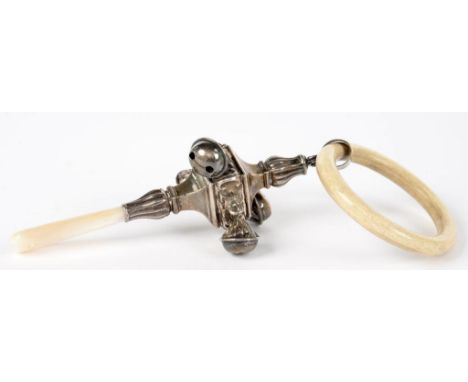 A SILVER BABY'S RATTLE WITH MOTHER OF PEARL HANDLE AND HUNG WITH FOUR BELLS, 11CM L, APPARENTLY LION PATENT ONLY