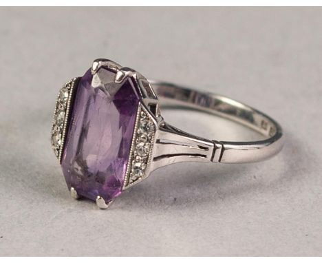 18ct WHITE GOLD AND PLATINUM RING set with oblong amethyst flanked by two rows each of three tiny diamonds, 3.4gms, ring size