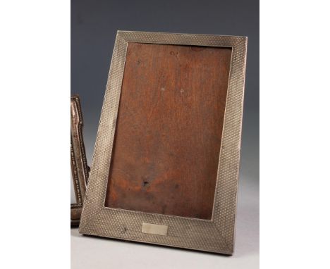 ART DECO EASEL PHOTOGRAPH FRAME, trapezoid, the silver front with engine turned decoration, 6 3/4" x 4 3/4" (17.1 x 12cm), Bi