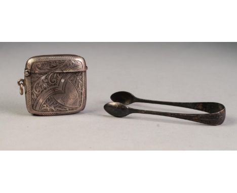 AN EDWARDIAN SILVER LARGE CURVED OBLONG VESTA CASE, foliate scroll engraved, Birmingham 1905 and a PAIR OF SUGAR TONGS, with 