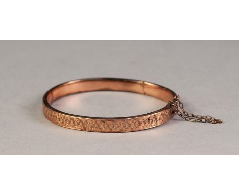EDWARDIAN 9ct GOLD HINGE OPENING BANGLE with foliate engraved top, Birmingham 1905, 8.8gms 