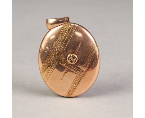 VICTORIAN (UNMARKED) GOLD COLOURED METAL ENGRAVED OVAL LOCKET PENDANT enclosing two Victorian portrait photographs, 1 3/4" (4
