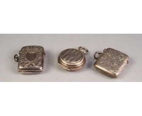 TWO ENGRAVED SILVER VESTA CASES, together with an ENGINE TURNED SILVER HALF SOVEREIGN HOLDER, all with ring suspensions, 2oz,