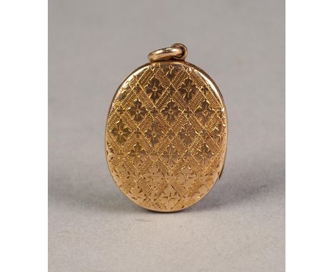 EDWARDIAN GOLD COLOURED METAL OVAL LOCKET PENDANT with all-over engraved diaper pattern, the interior with old portrait photo