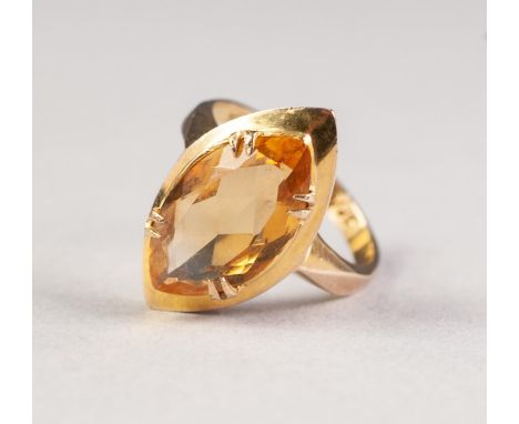 9ct GOLD DRESS RING, set with marquise shaped citrine, in a claw setting over a broad frame, 4.4gms, ring size L/M 