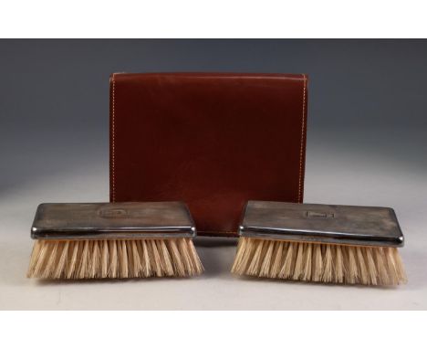 GEORGE V CASED PAIR OF ENGINE TURNED SILVER BACKED MILITARY HAIR BRUSHES, monogrammed, Birmingham 1935 