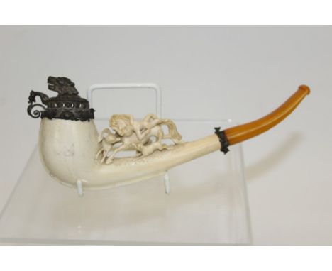 Unusual mid-19th century Austrian carved meerschaum pipe of elongated form, carved with surmounting figural group of a naked 