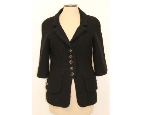 Chanel black bouclé jacket with logo gilt and fabric buttons, three-quarter length sleeves, layered back, gilt chain-stitched