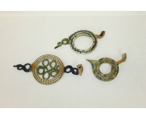 Three early 19th century Prattware coiled pipes - the largest 34cm long CONDITION REPORT Largest pipe has been broken where m