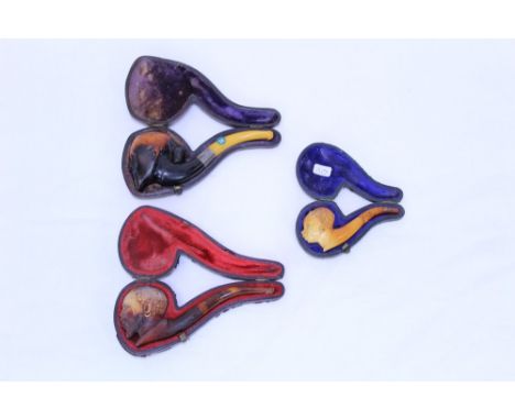 Carved meerschaum pipe, the bowl modelled as the head of an Oriental gentleman, the bowl lip with brass snake, white metal co