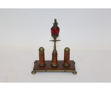 Early 20th century novelty oak and brass cigar lighter in the form of a street lamp, on rectangular plinth, 20cm wide