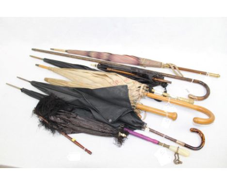 Early 20th century cane walking stick with crook handle and gold (9ct) mount, together with six ladies' umbrellas and parasol