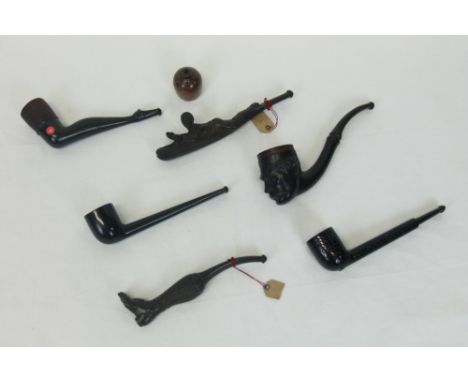Unusual early 20th century gutta-percha pipe, titled - The Rugby Pipe, modelled as a player scoring a try, burr-wood bowl, 15
