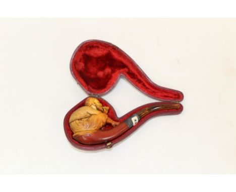 Late 19th century meerschaum pipe carved in the form of brigand smoking a pipe and wearing a dagger on his belt, with silver 