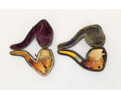 Late 19th century meerschaum pipe carved in the form of a French soldier wearing a kepi, with white metal mount and amber mou