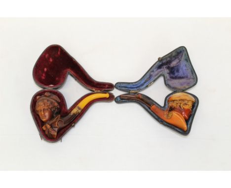 Late 19th century meerschaum pipe carved in the form of a lady wearing a bonnet, with amber mouthpiece, 13.5cm, in case and a