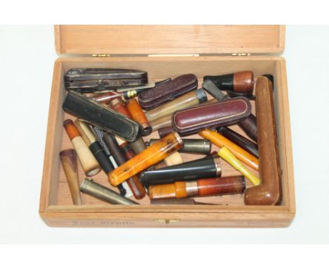 Collection of plain stem cheroot holders and cigarette holders - to include two gold (9ct) mounted holders, ivory, amber, gui