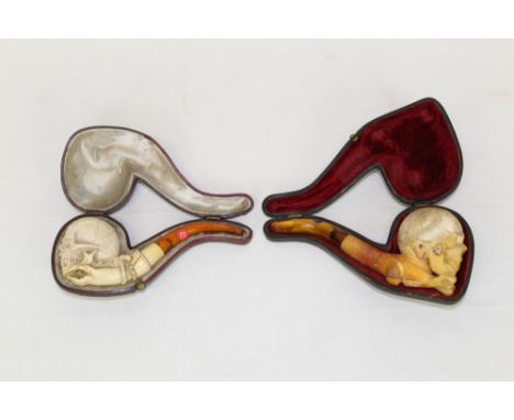 Late 19th century meerschaum pipe carved in the form of a skull and crossbones, with amber mouthpiece, 14cm, in fitted case a