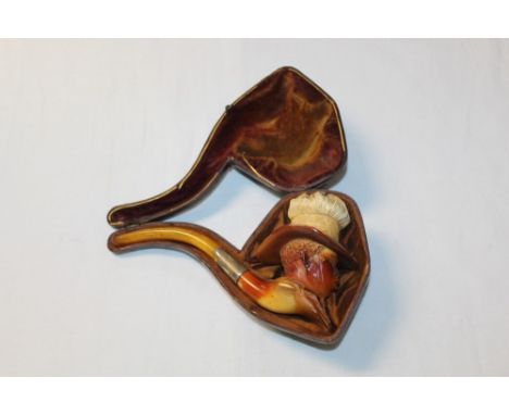 Late 19th century meerschaum pipe carved in the form of a Negro's head wearing a straw hat with flaming top, with silver coll