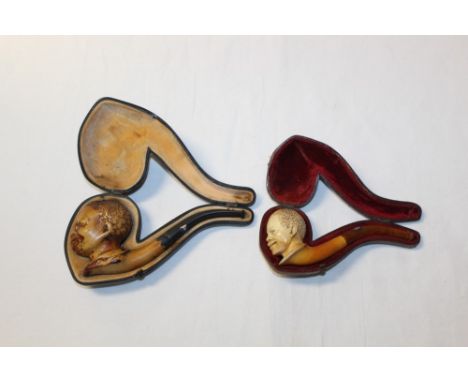 Late 19th century meerschaum pipe carved in the form of a Negro head, with amber mouthpiece, 14cm, in fitted case and another