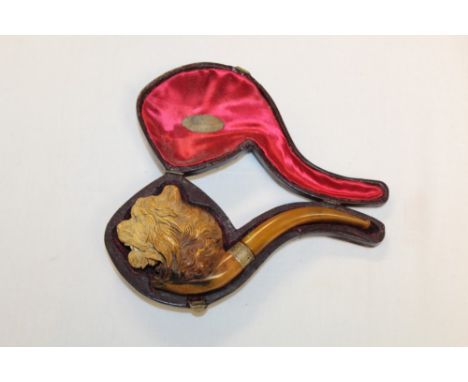 Good late 19th century meerschaum pipe carved with lion's head, silver collar, with amber mouthpiece, 18cm overall, in origin