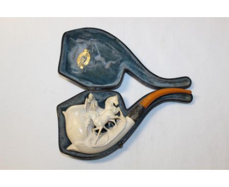 Large 19th century meerschaum pipe carved with three horses, silver collar and amber mouthpiece, 23cm, in fitted case CONDITI