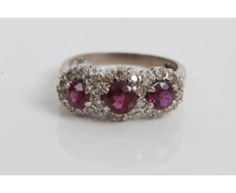 White gold (18ct) ruby and diamond triple cluster ring.  Size P CONDITION REPORT Total gross weight approximately 5.2 grams