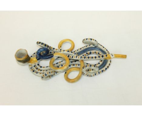 Good early 19th century English Prattware coiled pipe with mask bowl, 24cm long CONDITION REPORT Rim chips to bowl edge. The 