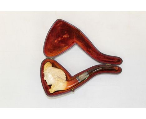 Late 19th century meerschaum pipe carved in the form of the head of a Red Indian with feather headdress, silver collar and am