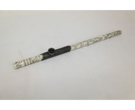 Chinese carved bone and white metal mounted opium pipe of cylindrical form, engraved with figural reserves, 48cm long