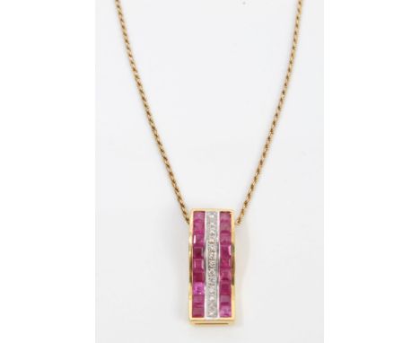 Diamond and ruby pendant in setting, stamped - 750, on chain   CONDITION REPORT  Pendant mount and chain both stamped - 750. 