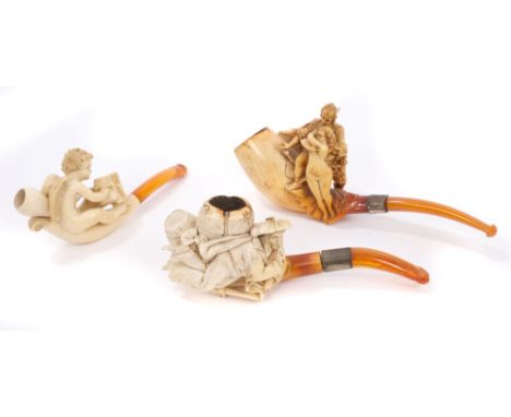 Late 19th century meerschaum pipe carved with naked nymph being accosted by Mercury, with silver collar and amber mouthpiece,