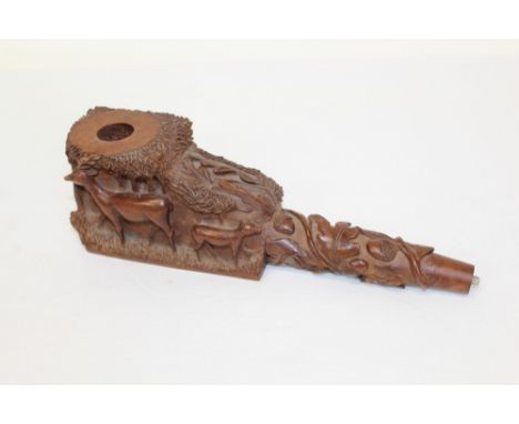 Finely carved Black Forest-style pipe of large proportions, carved with grazing deer and oak leaf ornament, 28cm long CONDITI