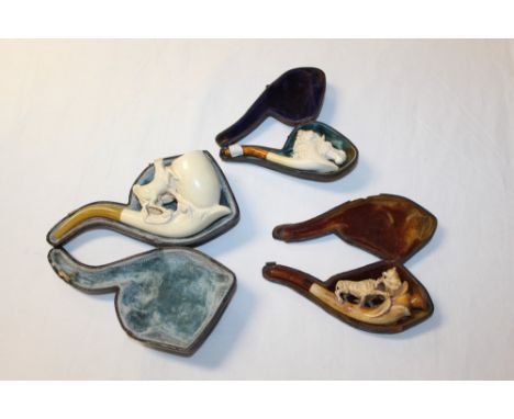 Late 19th century meerschaum pipe carved with wolf and rearing horses, with amber mouthpiece, 18.5cm, another cheroot holder 