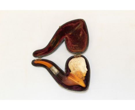 Late 19th century meerschaum pipe carved in the form of a bewhiskered gentleman wearing a rose in his buttonhole, with silver