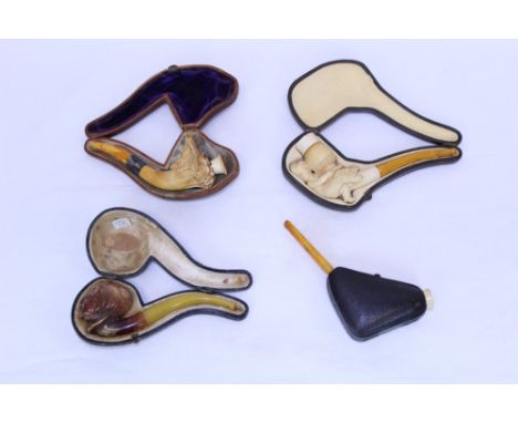 Finely carved and pierced meerschaum cheroot holder of L-shaped form, with pierced scroll ornament, together with another wit